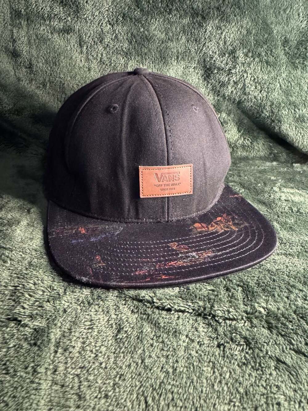 Vans Off The Wall Snapback Hat with Graphic Print Bill and Leather Patch